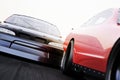 Front view of motor sports auto racing race cars racing on a track with Depth of Field Royalty Free Stock Photo