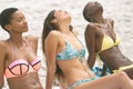 Women with bikini relaxing on beach Royalty Free Stock Photo