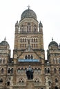 Front view of mumbai central railway station during dark grey moody cloudy day with bird flying over, a city landmark Royalty Free Stock Photo