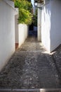 Front view of a narrow alley of a typical street in the historic Albaicin.