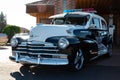 Front view of an old American police car Chevrolet Fleetmaster parked on the street