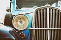 Front view of an old car. Retro vehicle detail. Old stylish blue car. Vintage classic car. Royalty Free Stock Photo