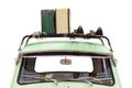 Old car with skis and luggage attached to a roof rack isolated on a white background Royalty Free Stock Photo