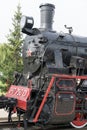 Front view of an old-fashioned steam locomotive.