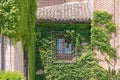 Front view of an old house focused on its roof and a window Royalty Free Stock Photo