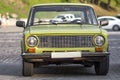 Front view of old russian classic car on city street. Car front exterior.