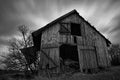 front view of an old spooky abandoned wooden barn Royalty Free Stock Photo