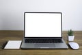 Front view of open laptop computer notebook with blank monitor white screen display on work table desk. Royalty Free Stock Photo