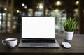 Front view of open laptop computer notebook with blank monitor white screen display on work table desk. Royalty Free Stock Photo