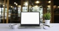 Front view of open laptop computer notebook with blank monitor white screen display on work table desk. Royalty Free Stock Photo