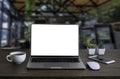 Front view of open laptop computer notebook with blank monitor white screen display on work table desk. Royalty Free Stock Photo