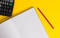 Front view open striped hard cover notebook lying pencil marker highlighter portable calculator colored background Empty Royalty Free Stock Photo