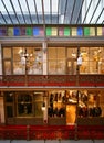 Storefronts on two stories and glass skylight roof of decorative Victorian shopping mail of Strand Arcade in Sydney CBD, Australia Royalty Free Stock Photo