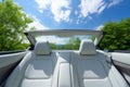 Front view of opulent white leather back passenger seats in a sleek modern luxury car Royalty Free Stock Photo