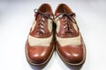 Front view of a pair of men`s vintage leather and webbing shoes Royalty Free Stock Photo