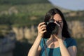 Asian woman taking photos of you with dslr camera Royalty Free Stock Photo