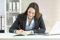 Executive signing a document at office
