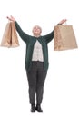 Front view portrait of pretty mature lady carrying shopping bags Royalty Free Stock Photo