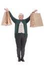 Front view portrait of pretty mature lady carrying shopping bags Royalty Free Stock Photo