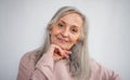 Front view portrait of senior woman standing indoors at home, looking at camera. Royalty Free Stock Photo