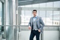 A front view of portrait of young businessman indoors in an office. Royalty Free Stock Photo