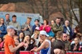 Front view of public heads contemplate city marathon runners.