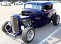 Front View of Purple 1940's Ford T-bucket antique convertible car.