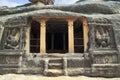 Front view of Ravanaphadi rock-cut temple, Aihole, Bagalkot, Karnataka. Two Kubera dwarpalas on the either side of the main entran Royalty Free Stock Photo