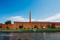 Front view on the red brick old ceramics factory on the Cojo Canal in Aveiro. Fabric of Jernymo Pereira Campos with tall chimney. Royalty Free Stock Photo