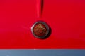 Front view of red classic collectible Mini car. Mini car antique logo