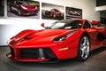 Front view of a red Ferrari LaFerrari in dealership