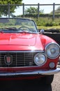 Front view of red Fiat 124 sport vintage motorcar. Royalty Free Stock Photo