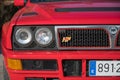 Front view of a red Lancia Delta HF on the street