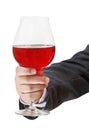 Front view of red wine glass in male hand Royalty Free Stock Photo