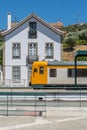 Front view of a regional train, typical of the Portuguese train network, at the train station in the city of Peso da Regua