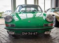 Front view of retro car Porsche 911 E Targa from 1970 in green color