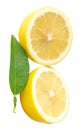 Front view of ripe yellow lemon fruit in slices in two halves and circle shape with green leaf in stack isolated on white Royalty Free Stock Photo