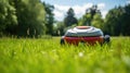 Front view of a robot lawn mower on summer meadow in the garden