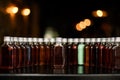 Front view on row of bottles with alcoholic drinks on bar counter. Royalty Free Stock Photo