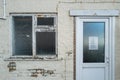 Front view of a run down house seen in a district ion known poverty. Royalty Free Stock Photo