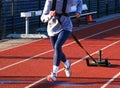 Front view of a runner pulling a sled with weight on top Royalty Free Stock Photo