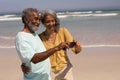 Senior couple taking selfie with mobile phone on beach Royalty Free Stock Photo