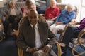 Front view of senior man looking at camera in nursing home Royalty Free Stock Photo