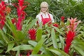 Front view of a senior woman working in botanical garden Royalty Free Stock Photo