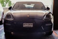 Front view shot of Black porsche sports car parked in the parking lot Royalty Free Stock Photo