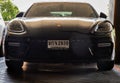 Front view shot of Black porsche sports car parked in the parking lot Royalty Free Stock Photo