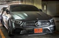 Front view shot of Matte black mercedes sports car parked in the parking lot