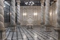 Front view of single ancient sculptures of stone chair in antique decorated room