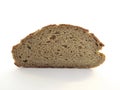 Front view of slice of artisan rye bread isolated on white background. Close-up of a piece of freshly baked artisan whole wheat Royalty Free Stock Photo