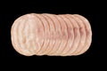 Front view of sliced smoked ham meat isolated on black background. Raw ham isolated over white Royalty Free Stock Photo